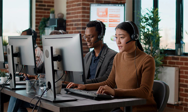 Call Centre employees on headsets